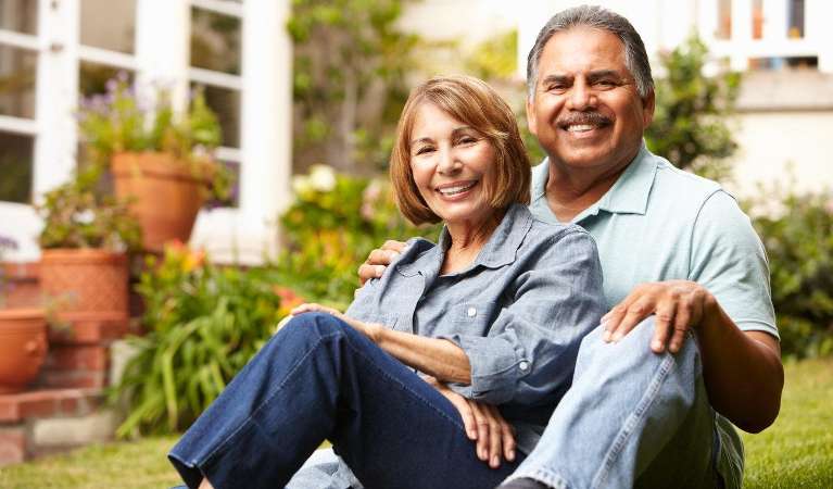 A picture of elderly couple smiling after dental implants at South Chico Dental Care, Chico, CA.