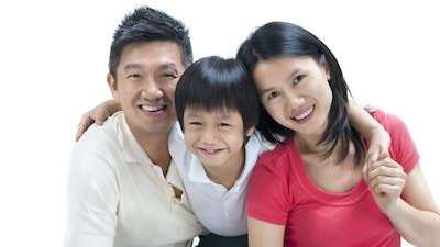 Family smiling after dental check up in South Chico, CA