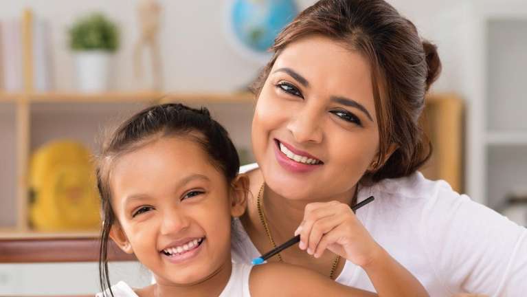 Mother and kid smiling after dental check up in South Chico, CA