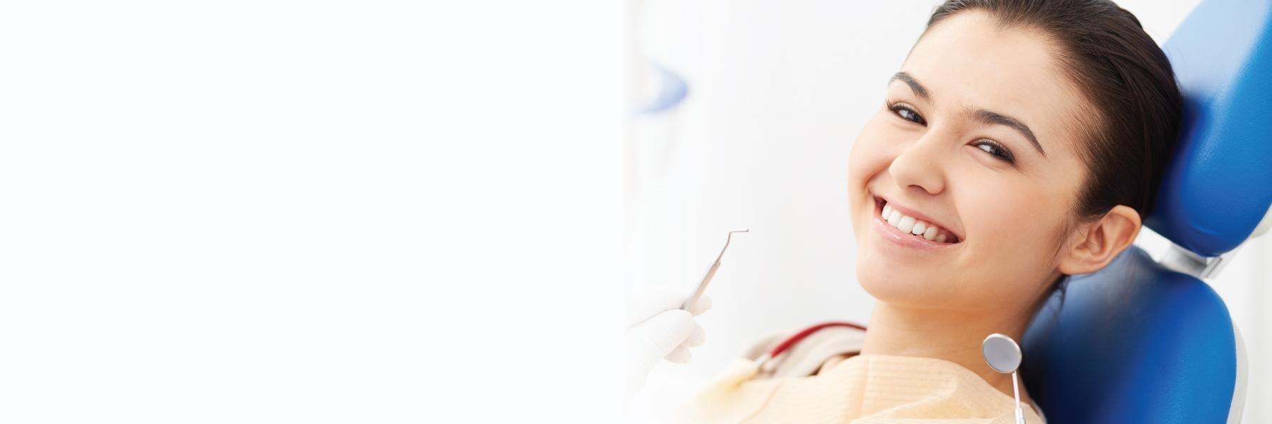 Woman at dentist getting dental crowns in chico, CA